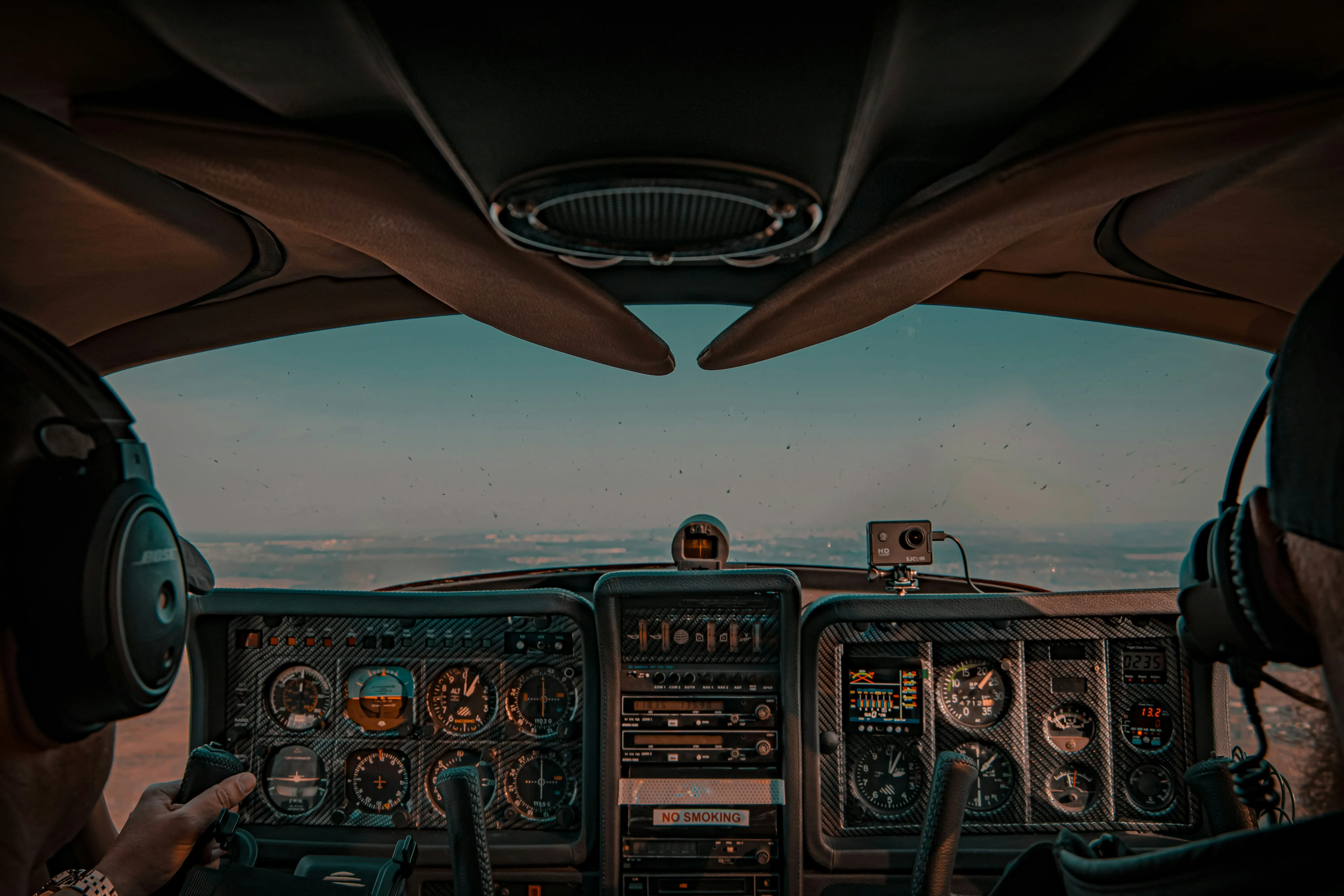 Instructor showing IFR charts to a student in cockpit