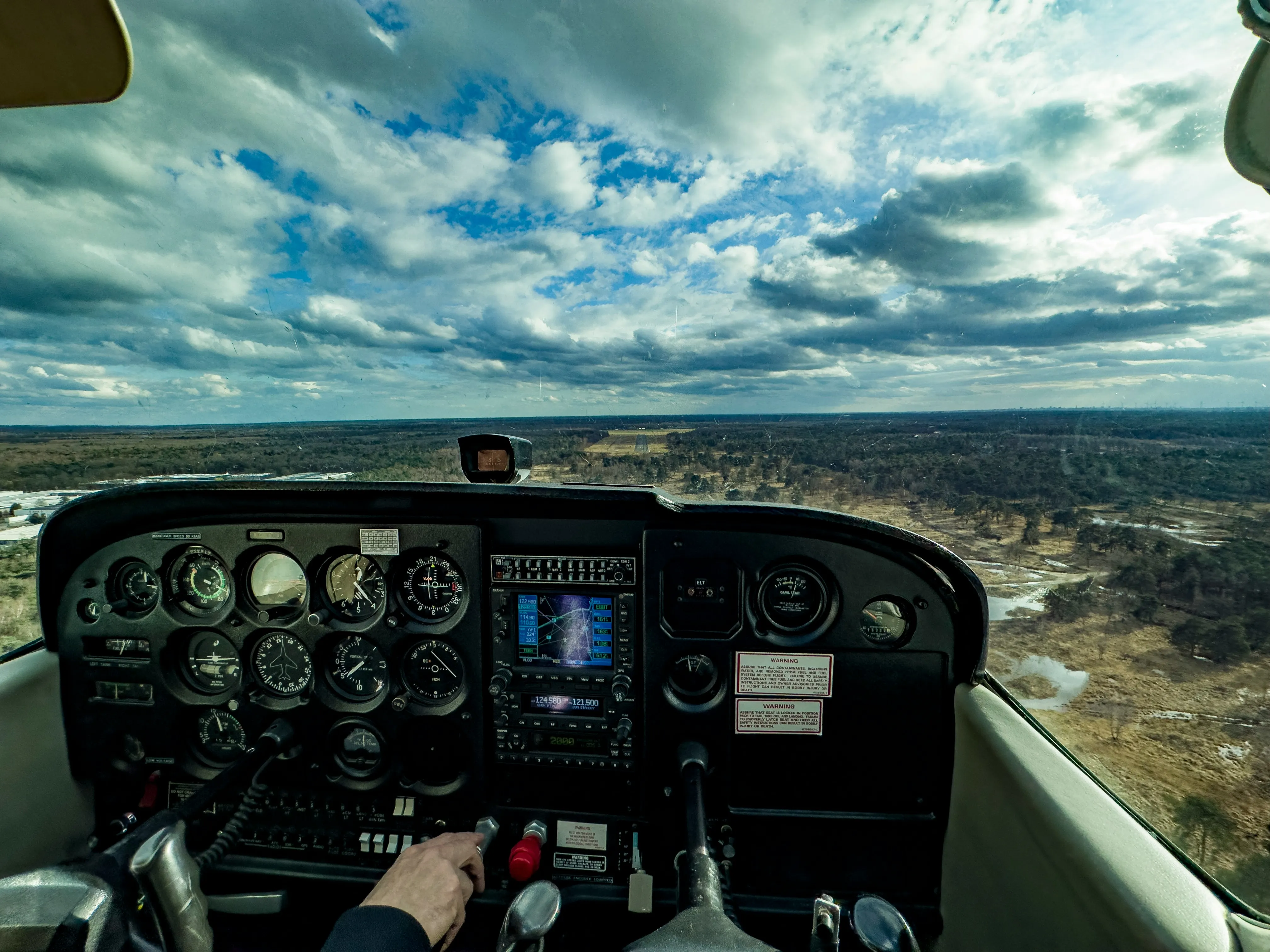 Flight instructor coaching a student pre-flight