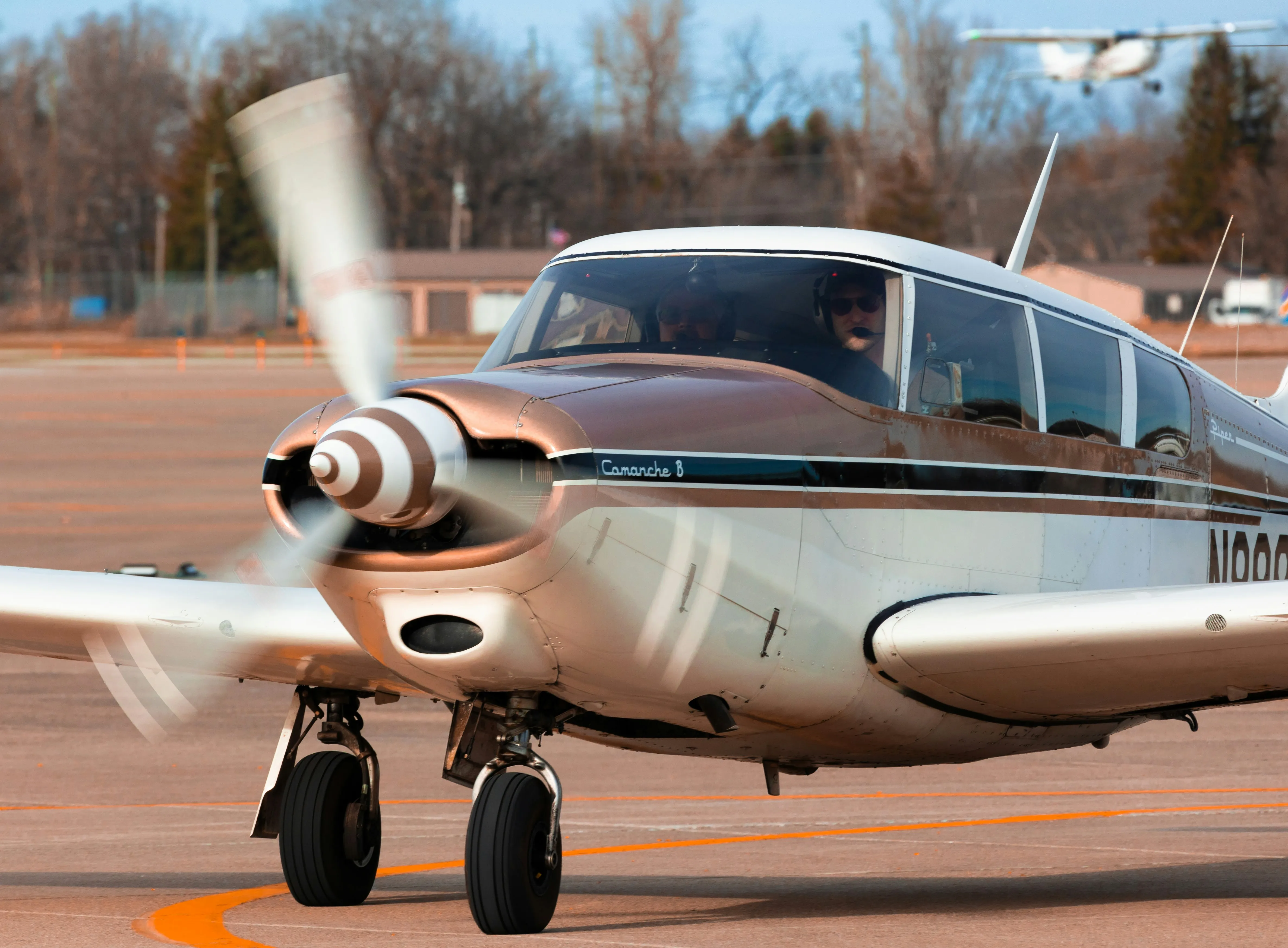 Echo Aviation instructors and staff in front of a Cessna at KHMP