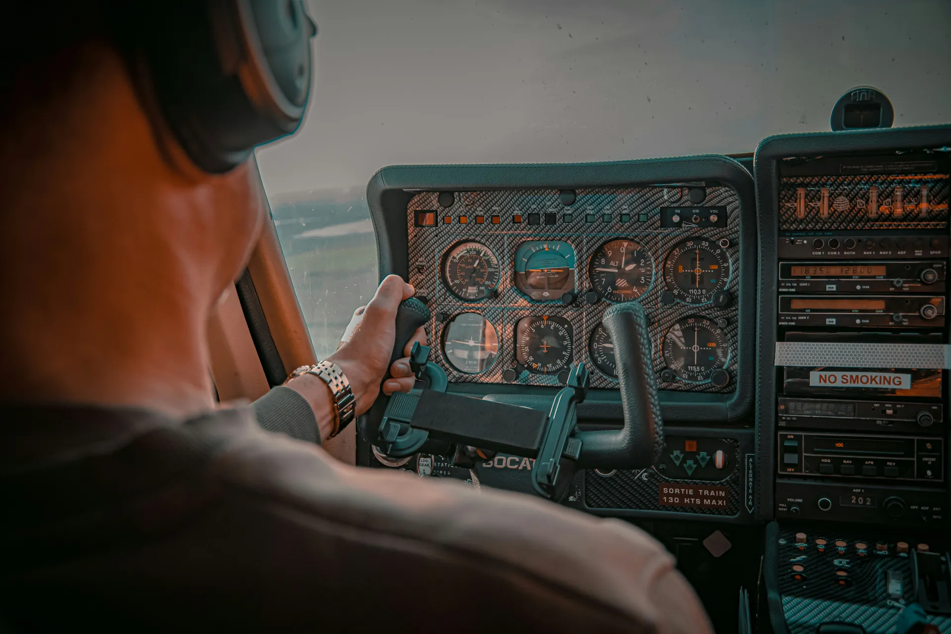 Flight instructor teaching instrument procedures in the cockpit